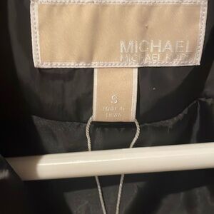 Michael Khors black puffer vest.